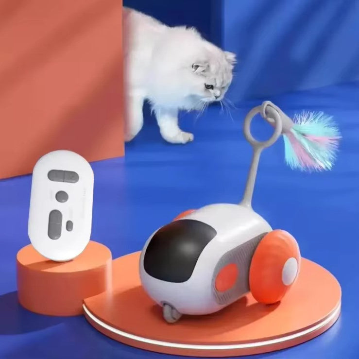 Pet toy with a remote control and a cat interacting with it on a blue background