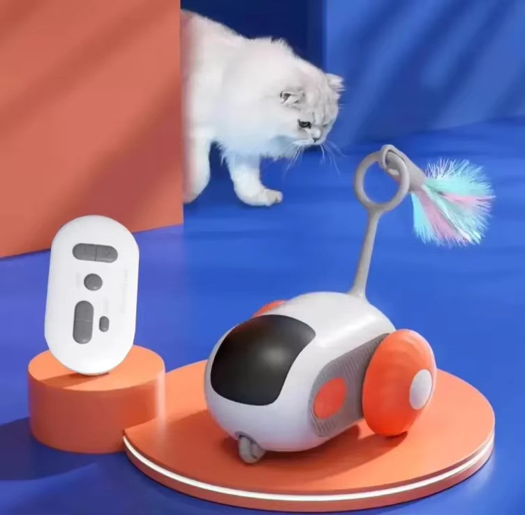Pet toy with a remote control and a cat interacting with it on a blue background