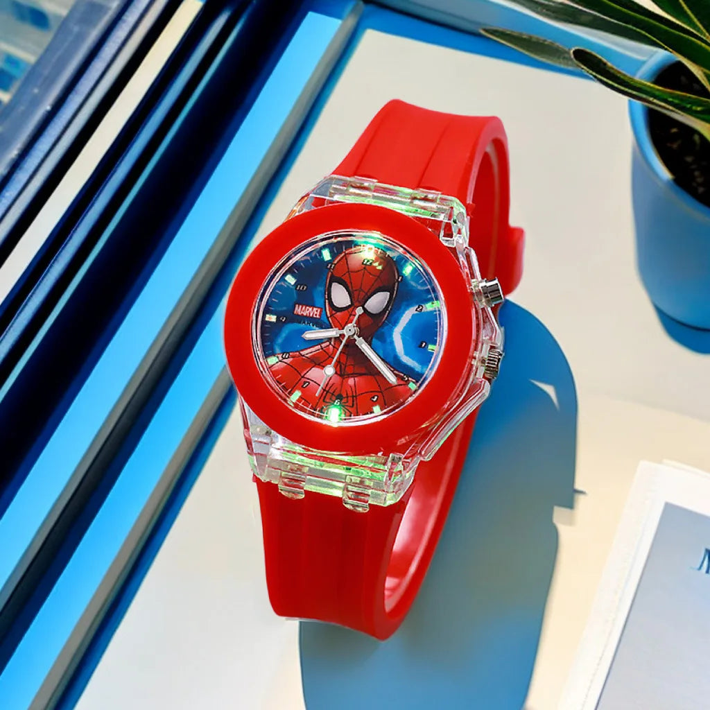 Red Spider-Man watch on a blue surface with a plant in the background