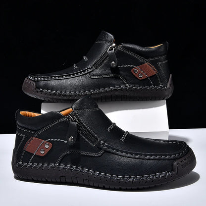 Black leather shoes with brown accents on a white and black background