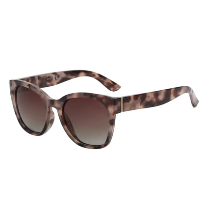 Sunglasses with tortoiseshell frame and gradient lenses on a white background