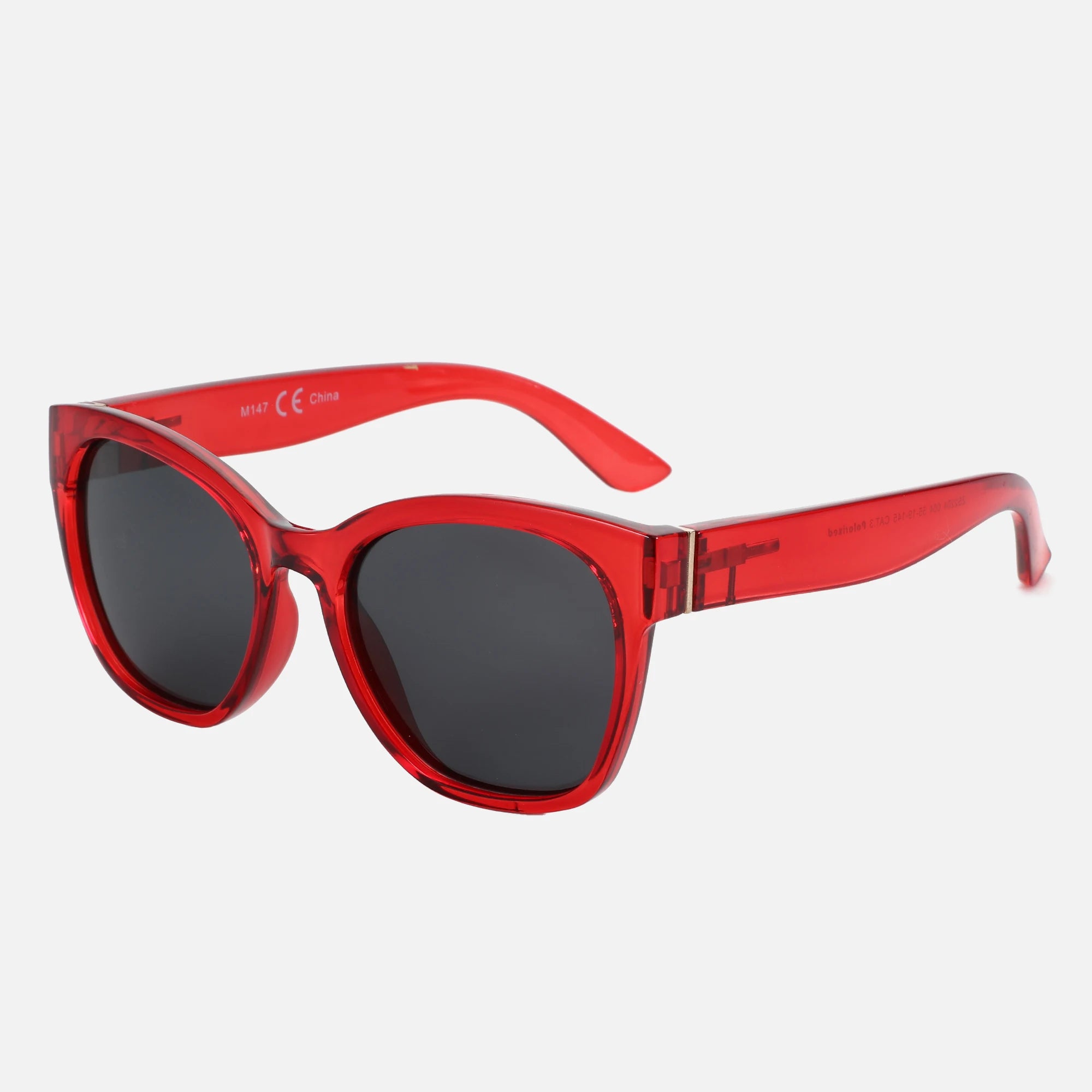 Red sunglasses with black lenses on a white background