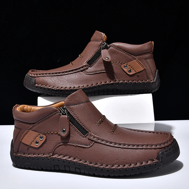 Brown leather shoes with zippers on a white and black background