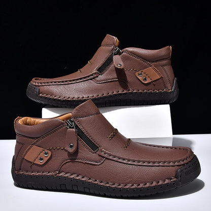 Brown leather shoes with zippers on a white and black background