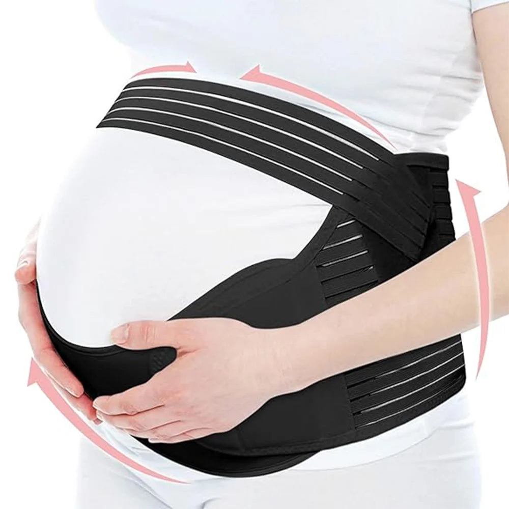 Pregnant woman wearing a black maternity belt on a white background