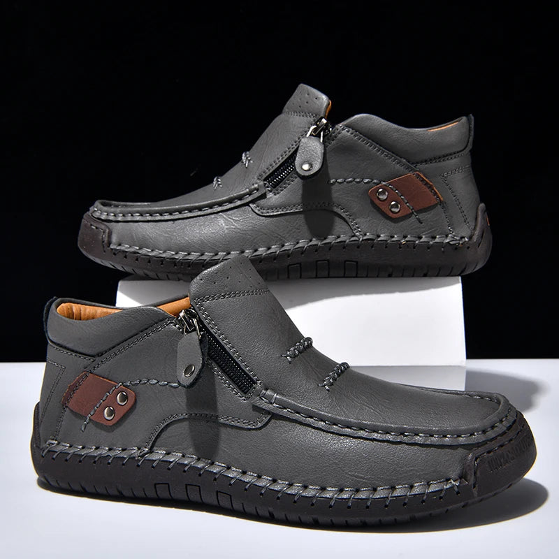 Gray casual shoes with brown accents on a white background