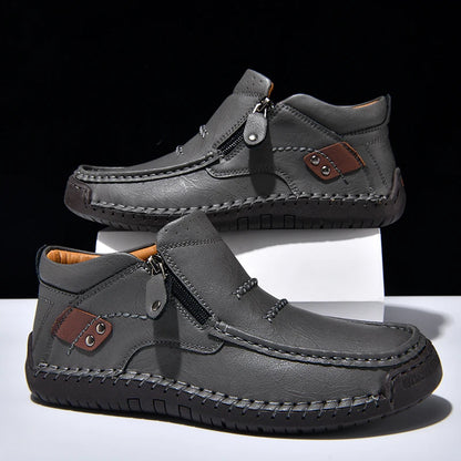 Gray casual shoes with brown accents on a white background