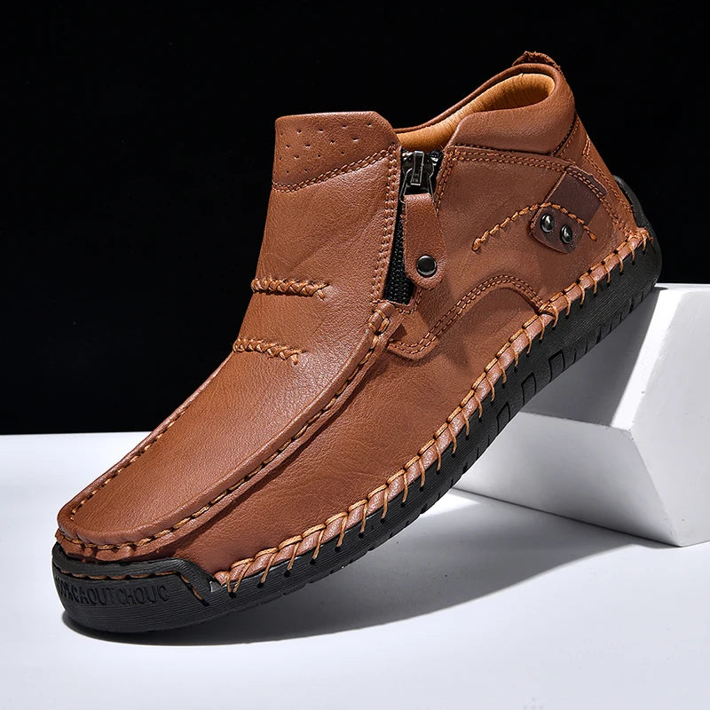 Brown leather shoe with a zipper on a white platform against a black background