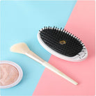 SprayGlide Brush: Smooths and styles with spray-infused ease. - Mag & Doudy